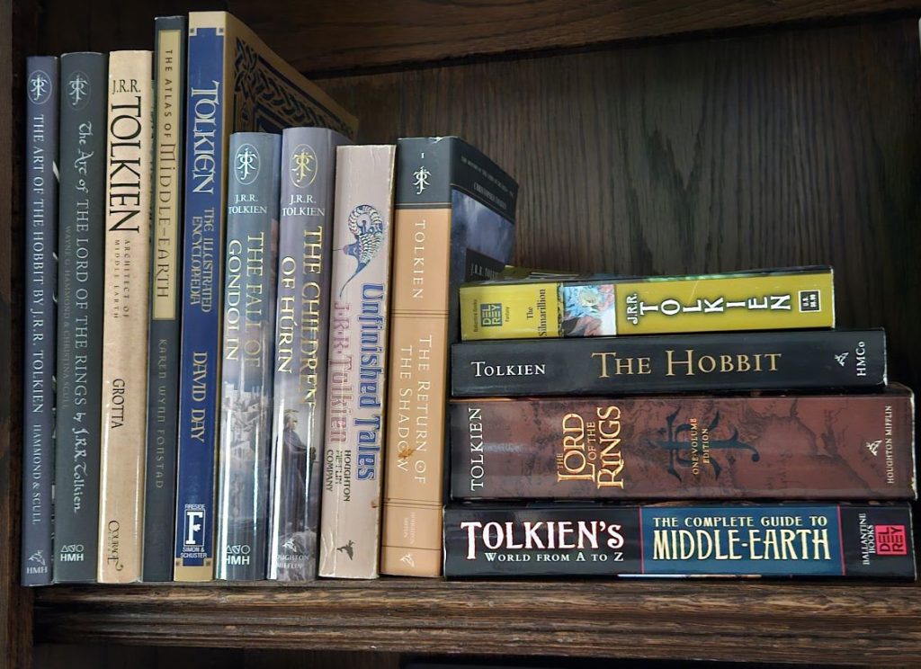 Several books related to Middle Earth, including the Hobbit, The Lord of the Rings, and The Silmarillion, sitting on my bookshelf.
