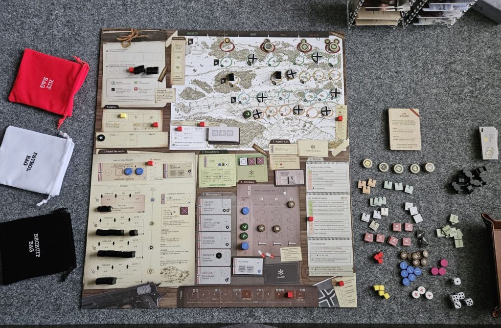 The Halls of Hegra board game and its components at the end of a play session resulting in an "Unconditional Surrender".